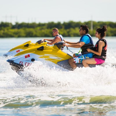 a person riding a jetski in key west