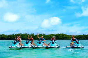 a group of people in a boat on a body of water