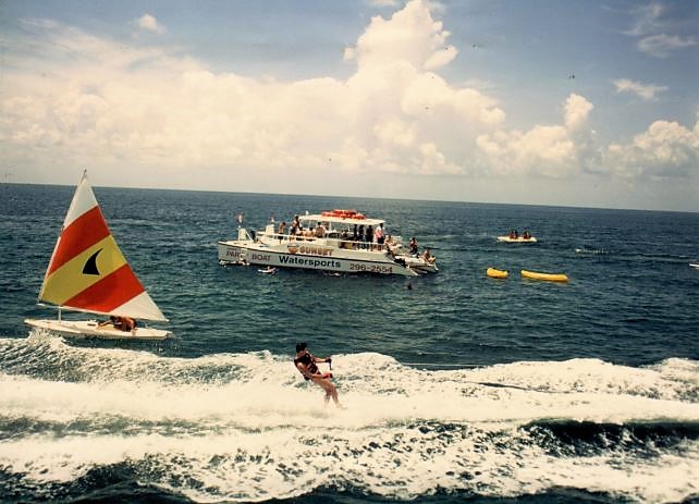 a group of people on a boat in the ocean