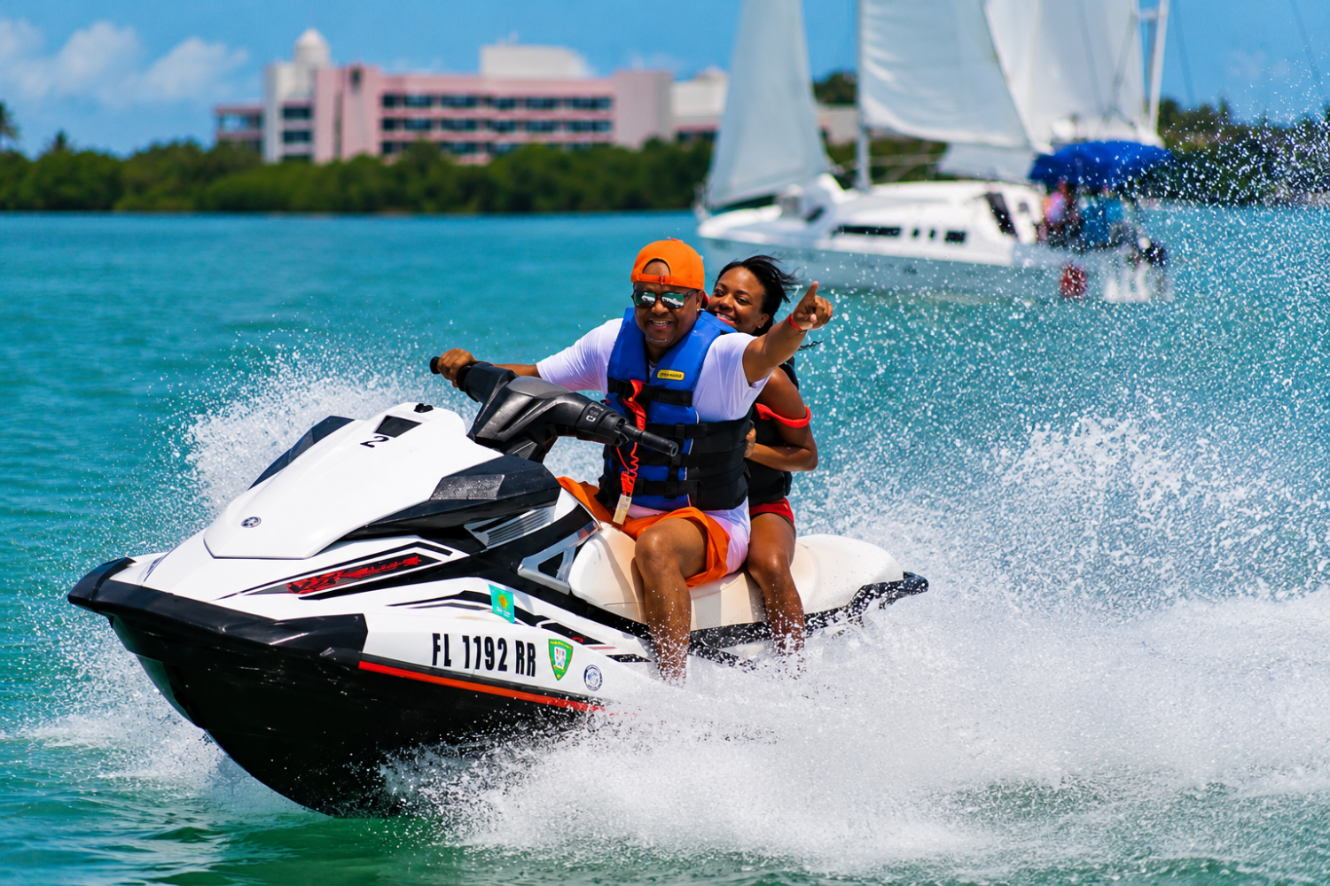 Two guests riding a Jet Ski on a Sunset Watersports Key West tour